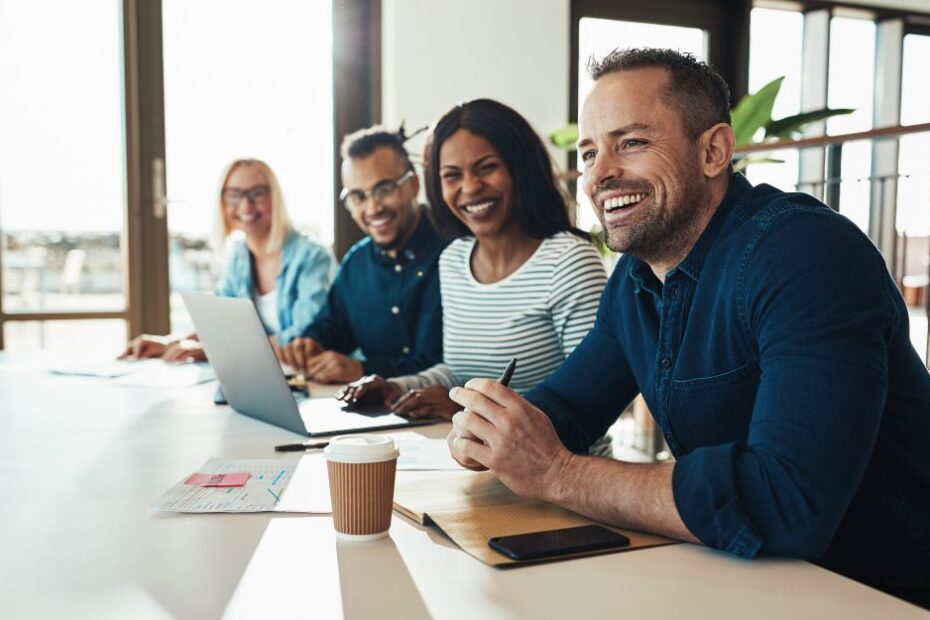 HR professionals and decision makers having a laugh at a meeting