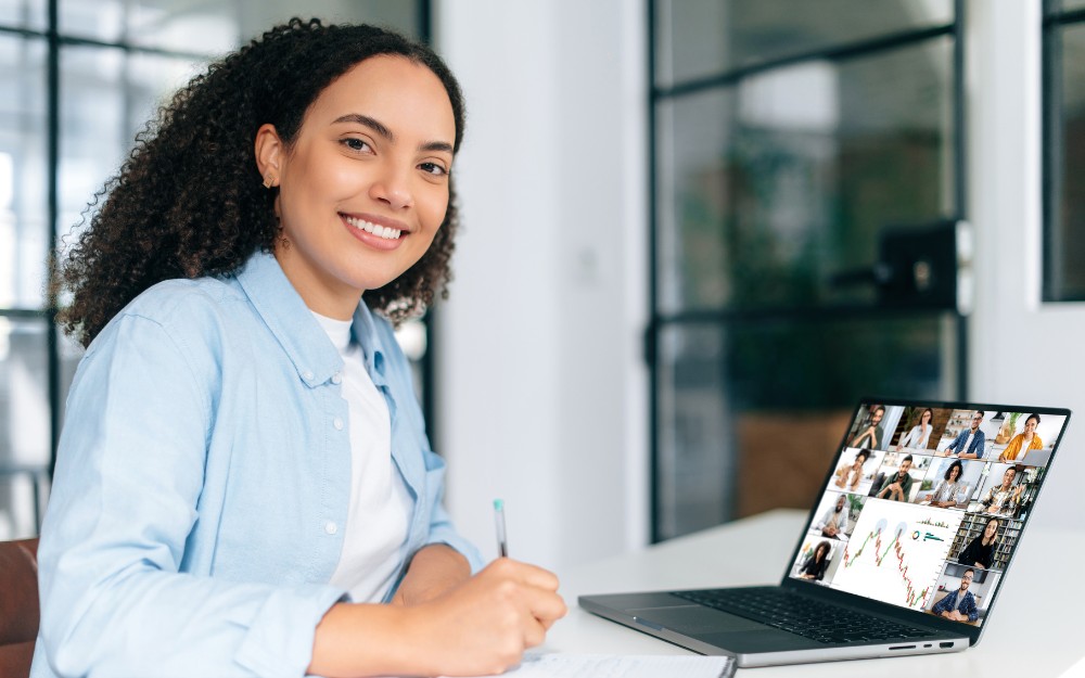 HR professional attending a webinar to become a specialist in the role she is in.